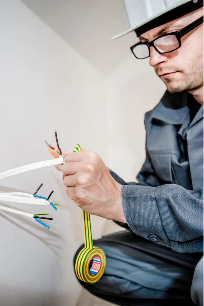 electrician splicing wires for upcoming installations